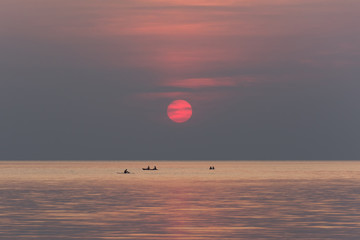 Stand up paddle boarding on quiet sea