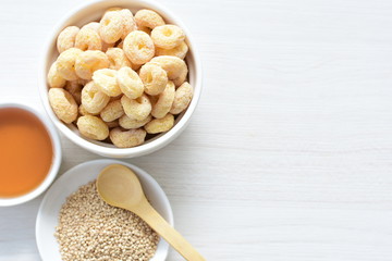 Quinoa cereal, accompanied by seeds and honey