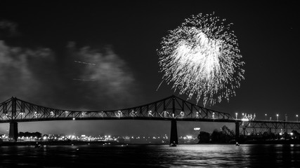 Photograph of fireworks. Jacques Cartier bridge with fireworks. Montreal Quebec. Fireworks.
