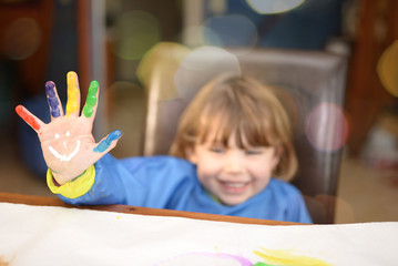 portrait of a pretty little girl painting
