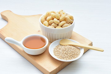 Quinoa cereal, accompanied by seeds and honey