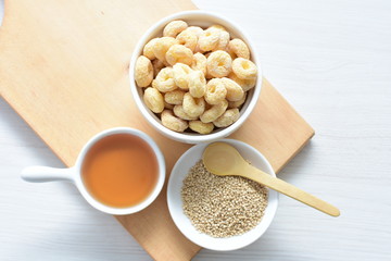 Quinoa cereal, accompanied by seeds and honey