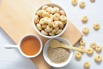 Quinoa cereal, accompanied by seeds and honey