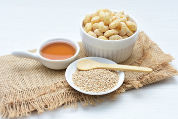 Quinoa cereal, accompanied by seeds and honey
