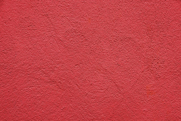 The texture of the surface is red. Uneven surface