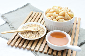 Quinoa cereal, accompanied by seeds and honey