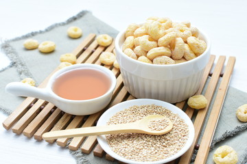 Quinoa cereal, accompanied by seeds and honey