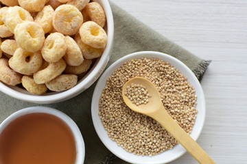 Quinoa cereal, accompanied by seeds and honey