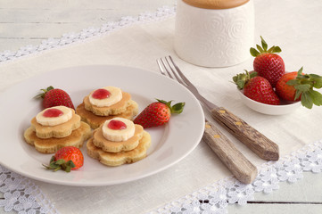 pancakes with jam and strawberries.