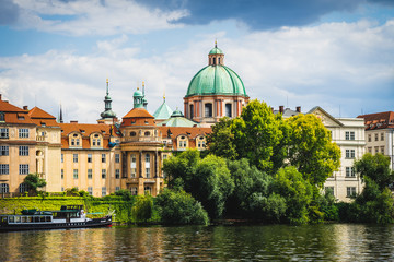 Fototapeta na wymiar Scenic panorama cityscape view of Moldava river boat Prague in Czech Republic.