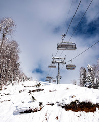 mountain ski resort Rosa Khutor in Sochi.  Winter sunny day with cloudy .