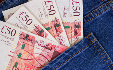 Money in the pocket of jeans. English pounds