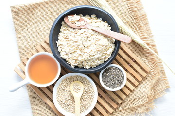 Natural oatmeal, accompanied by seeds and honey