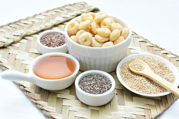 Quinoa cereal, accompanied by seeds and honey