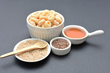 Quinoa cereal, accompanied by seeds and honey