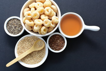 Quinoa cereal, accompanied by seeds and honey