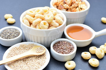 Quinoa cereal, accompanied by seeds and honey