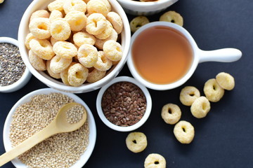 Quinoa cereal, accompanied by seeds and honey