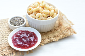 Quinoa cereal, accompanied by seeds and honey