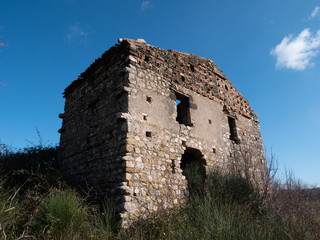 old abandoned farmhouse in a countryside of southern Italy