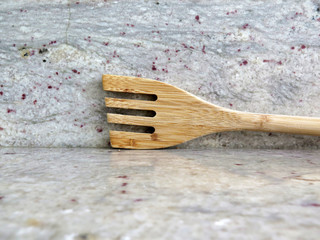 wooden fork on kitchen counter-top
