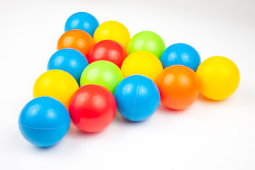 Colored plastic balls on white background. leisure and game items. round objects