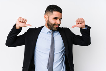 Young latin business woman against a white background isolated feels proud and self confident, example to follow.