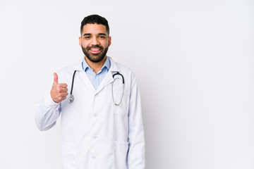 Young arabian doctor man isolated smiling and raising thumb up