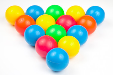 Colored plastic balls on white background. leisure and game items. round objects
