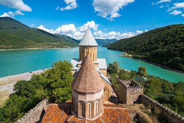 Ananuri in Georgia, fortress with orthodox monastery and reservoir on a hill over water reservoir 
