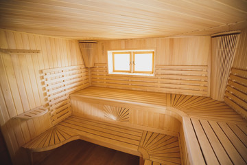 Obraz na płótnie Canvas Big light modern sauna in the Russian traditions from natural wood.
