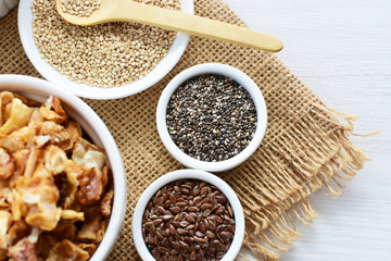 Granola mix accompanied by seeds and honey