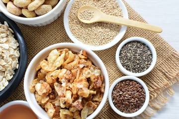 Granola mix accompanied by seeds and honey