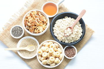 Granola mix accompanied by seeds and honey
