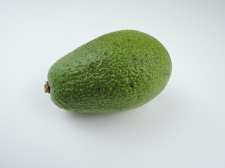 ripe green avocado on a white background isolated