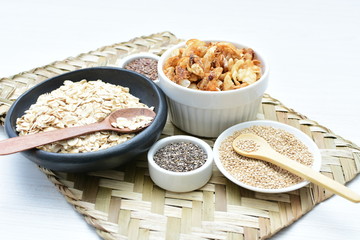 Granola mix accompanied by seeds and honey