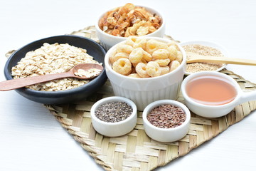 Granola mix accompanied by seeds and honey