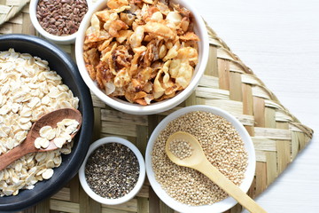 Granola mix accompanied by seeds and honey