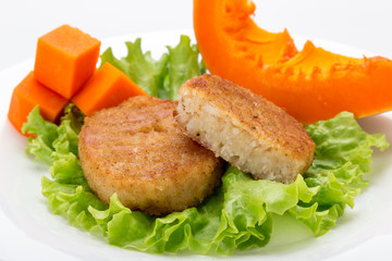 Cooked vegetarian cutlets on lettuce leaves. Fried breaded cutlet isolated on white background. freshly grilled burger vegetarian cutlets. Tasty crispy fried fresh cutlets. Juicy delicious cutlets