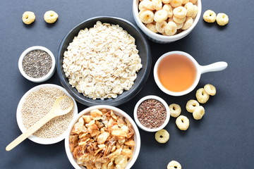 Granola mix accompanied by seeds and honey