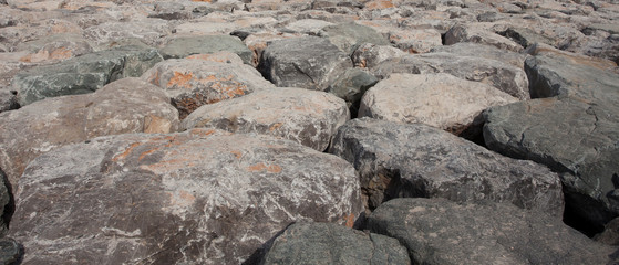 big bloulders rocks near the sea for shore protection