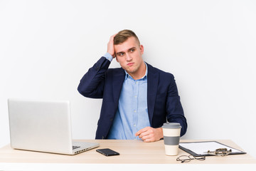 Young business man with a laptop being shocked, she has remembered important meeting.