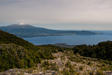 volcano motorboat boat osorno cabulco villarica chile volcan thaw river snow on top chile puerto varas puerto mont pucon villarica osorno blue water blue sky sunset lagun photo Jovani Prochnov