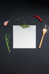 Blank notepad pages with greens herbs and spices