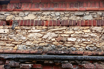 Old dolomite and red brick wall