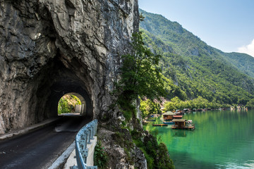 Houseboats (housing on raft) and tunnel in National Park Tara in Serbia  - obrazy, fototapety, plakaty
