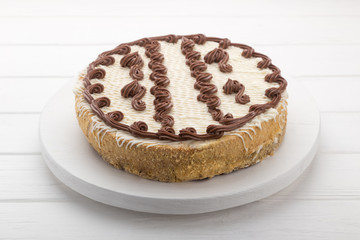 Large cake on a white wooden table. birthday cake.