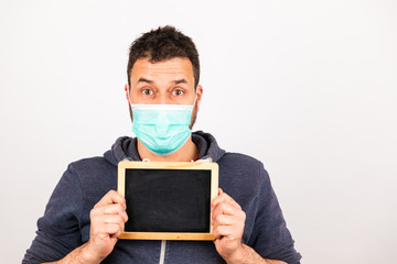 man with a mouthguard with blackboard isolated against white background