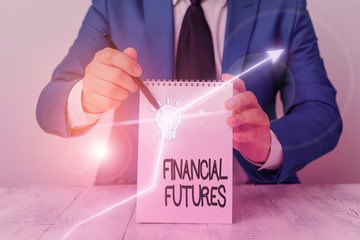 Conceptual hand writing showing Financial Futures. Concept meaning contract to buy or sell...