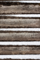 Slate background with snow lying on it